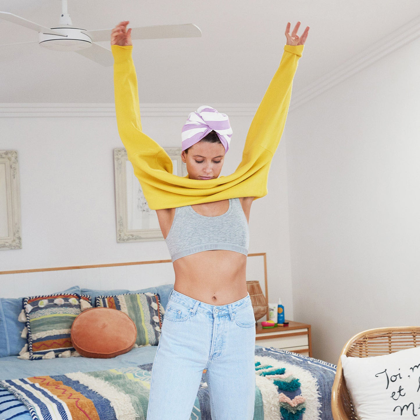 girl getting dressed in hair wrap