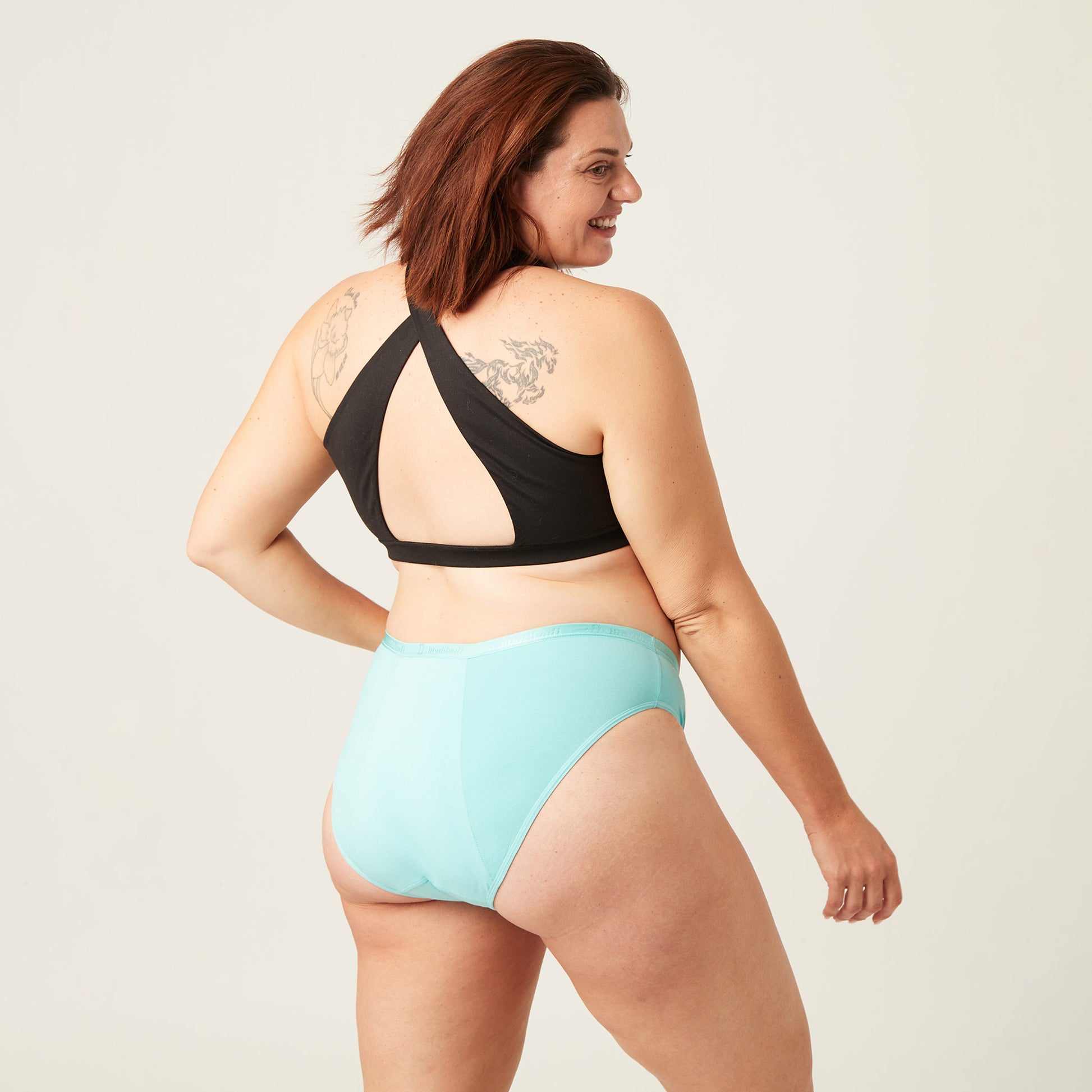 Happy large lady wearing Modibodi period underwear 