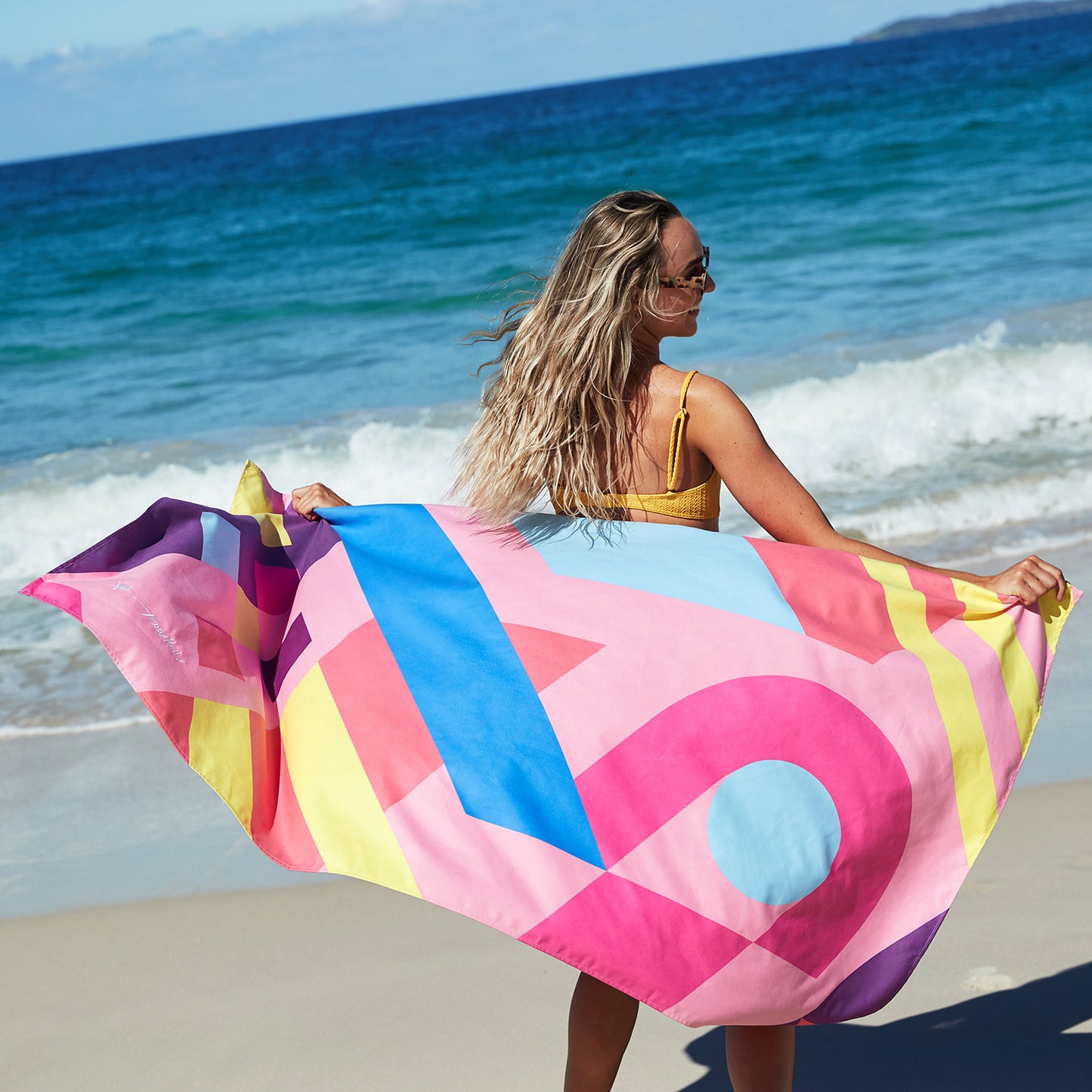 Sand Free Beach towel blowing in wind 